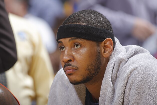 OAKLAND, CA - MARCH 30: Carmelo Anthony #7 of the New York Knicks rests on the bench during the game against the Golden State Warriors on March 30, 2014 at Oracle Arena in Oakland, California. NOTE TO USER: User expressly acknowledges and agrees that, by downloading and or using this photograph, user is consenting to the terms and conditions of Getty Images License Agreement. Mandatory Copyright Notice: Copyright 2014 NBAE (Photo by Rocky Widner/NBAE via Getty Images)