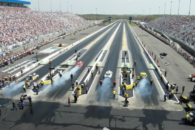 Pro Stock cars warm up tires on the impressive zMAX Dragway lanes.