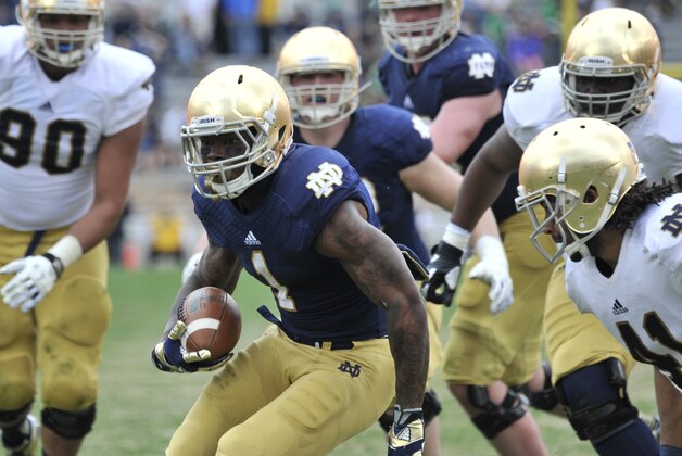 Notre Dame running back Greg Bryant heads up field during the Blue Gold game an  NCAA football game marking the end of spring practice at Notre Dame Stadium Saturday April 12, 2014 in South Bend, Ind. (AP Photo/Joe Raymond)
