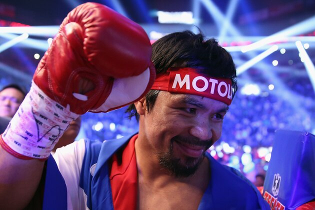 LAS VEGAS, NV - APRIL 12:  Manny Pacquiao acknowledges people in the crowd prior to fighting Timothy Bradley at the MGM Grand Garden Arena on April 12, 2014 in Las Vegas, Nevada.  (Photo by Jeff Gross/Getty Images)