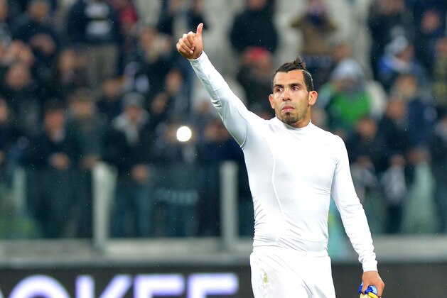 Juventus forward Carlos Tevez, of Argentina, celebrates at the end of a Serie A soccer match between Juventus and Parma at the Juventus stadium, in Turin, Italy, Wednesday, March 26, 2014. (AP Photo/Massimo Pinca)