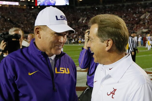 TUSCALOOSA, AL - NOVEMBER 09: (L-R) Head coach Les Miles of the LSU Tigers talks with head coach Nick Saban of the Alabama Crimson Tide before the game at Bryant-Denny Stadium on November 9, 2013 in Tuscaloosa, Alabama. (Photo by Kevin C. Cox/Getty Images) TUSCALOOSA, AL - NOVEMBER 09: (L-R) Head coach Les Miles of the LSU Tigers talks with head coach Nick Saban of the Alabama Crimson Tide before the game at Bryant-Denny Stadium on November 9, 2013 in Tuscaloosa, Alabama. (Photo by Kevin C. Cox/Getty Images)