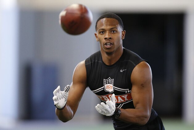 Oklahoma State's Justin Gilbert catches a pass during Oklahoma State's pro day for NFL scouts in Stillwater, Okla., Thursday, March 13, 2014. (AP Photo/Sue Ogrocki)