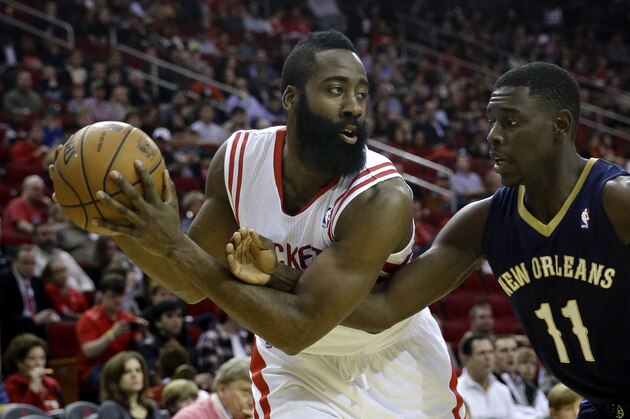 New Orleans Pelicans' Jrue Holiday (11) tries to steal the ball from Houston Rockets' James Harden, left, during the first quarter of an NBA basketball game on Saturday, Dec. 28, 2013, in Houston. (AP Photo/David J. Phillip) New Orleans Pelicans' Jrue Holiday (11) tries to steal the ball from Houston Rockets' James Harden, left, during the first quarter of an NBA basketball game on Saturday, Dec. 28, 2013, in Houston. (AP Photo/David J. Phillip)