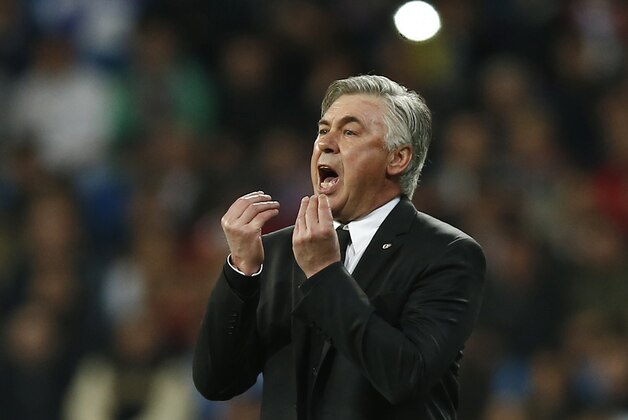 Real's coach Carlo Ancelotti gestures during a Champions League quarterfinal first leg soccer match between Real Madrid and Borussia Dortmund at the Santiago Bernabeu   stadium in Madrid, Spain, Wednesday, April 2, 2014. (AP Photo/Andres Kudacki)