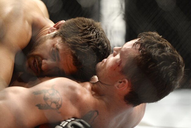 Apr 16, 2014; Quebec City, Quebec, Canada; Patrick Cote (red gloves) fights against Kyle Noke (blue gloves) during their welterweight bout at Colisee Pepsi. Mandatory Credit: Eric Bolte-USA TODAY Sports Apr 16, 2014; Quebec City, Quebec, Canada; Patrick Cote (red gloves) fights against Kyle Noke (blue gloves) during their welterweight bout at Colisee Pepsi. Mandatory Credit: Eric Bolte-USA TODAY Sports