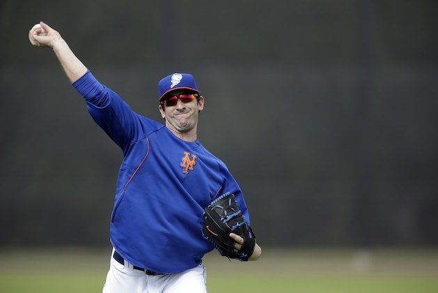 New York Mets pitcher Matt Harvey plays catch during spring training baseball practice Saturday, Feb. 22, 2014, in Port St. Lucie, Fla. Harvey underwent Tommy John surgery on Oct. 22. (AP Photo/Jeff Roberson)