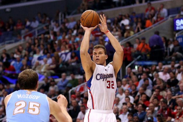 LOS ANGELES, CA - APRIL 15:  Blake Griffin #32 of the Los Angeles Clippers shoots over Timofey Mozgov #25 of the Denver Nuggets at Staples Center on April 15, 2014 in Los Angeles, California.  The Clippers won 117-105. NOTE TO USER: User expressly acknowledges and agrees that, by downloading and or using this photograph, User is consenting to the terms and conditions of the Getty Images License Agreement.  (Photo by Stephen Dunn/Getty Images)