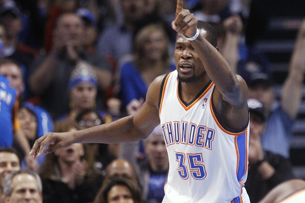Oklahoma City Thunder forward Kevin Durant gestures following a basket in the first quarter of an NBA basketball game against the Detroit Pistons in Oklahoma City, Wednesday, April 16, 2014. (AP Photo/Sue Ogrocki)