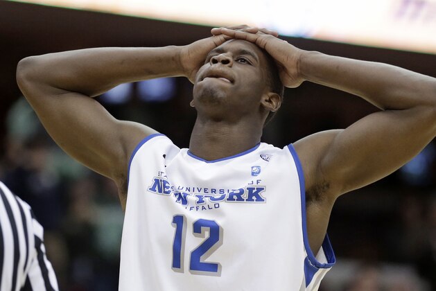 Buffalo's Javon McCrea reacts in the final seconds of the second half of an NCAA college basketball game against Eastern Michigan at the Mid-American Conference tournament Thursday, March 13, 2014, in Cleveland. Eastern Michigan defeated Buffalo 69-64. (AP Photo/Tony Dejak)
