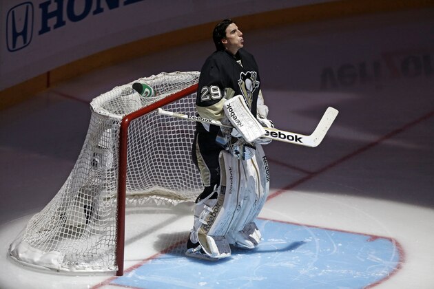 Pittsburgh Penguins goalie Marc-Andre Fleury (29) stands in front of his goal during the national anthem before Game 2 of an NHL hockey Stanley Cup first-round playoff series against the New York Islanders, Friday, May 3, 2013, in Pittsburgh. The Islanders won 4-3. (AP Photo/Gene J. Puskar)