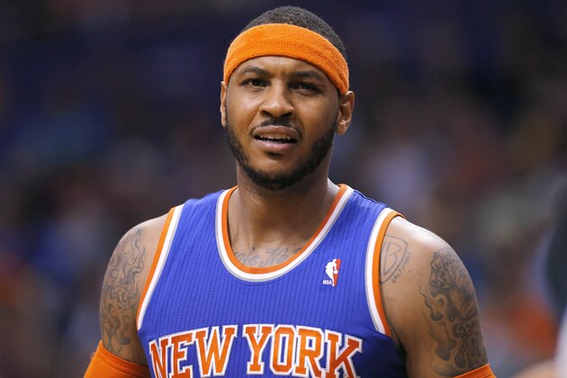 New York Knicks' Carmelo Anthony reacts to an official's call during the second half of an NBA basketball game against the Phoenix Suns, Friday, March 28, 2014, in Phoenix. The Suns won 112-88. (AP Photo/Matt York)