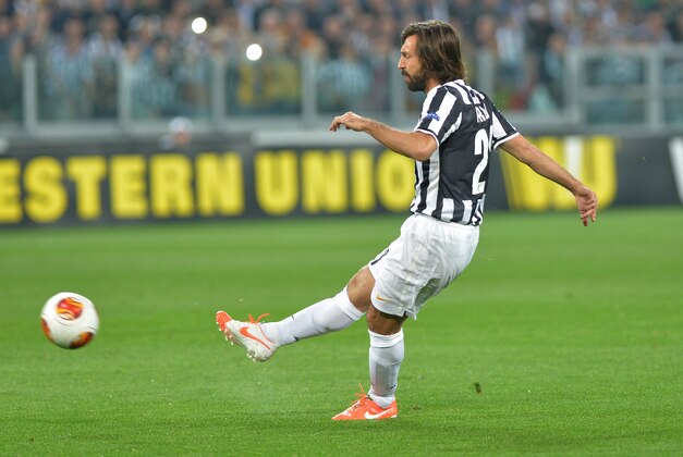 Juventus midfielder Andrea Pirlo scores a goal during the Europa League quarterfinal soccer match between Juventus and Olympic Lyon at the Juventus stadium, in Turin, Italy, Thursday, April 10, 2014. (AP Photo/ Massimo Pinca)