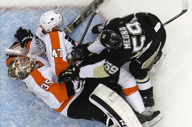 Pittsburgh Penguins' Jayson Megna (59) checks Philadelphia Flyers' Andrew MacDonald (47) into Flyers goalie Steve Mason (35) in the second period of an NHL hockey game in Pittsburgh, Saturday, April 12, 2014. Megna was penalized for goaltender interference. Mason was shaken up on the play, and did not return for the third period. The Flyers won 4-3 in overtime. (AP Photo/Gene J. Puskar) Pittsburgh Penguins' Jayson Megna (59) checks Philadelphia Flyers' Andrew MacDonald (47) into Flyers goalie Steve Mason (35) in the second period of an NHL hockey game in Pittsburgh, Saturday, April 12, 2014. Megna was penalized for goaltender interference. Mason was shaken up on the play, and did not return for the third period. The Flyers won 4-3 in overtime. (AP Photo/Gene J. Puskar)