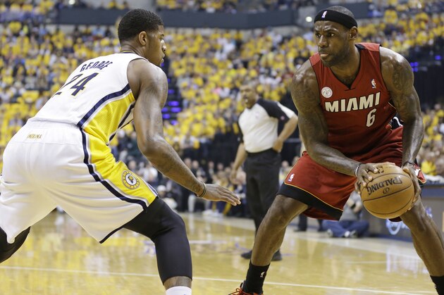 Miami Heat forward LeBron James (6) drives the ball against Indiana Pacers forward Paul George (24) during the first half of Game 6 of the NBA Eastern Conference basketball finals in Indianapolis, Saturday, June 1, 2013. (AP Photo/Michael Conroy)