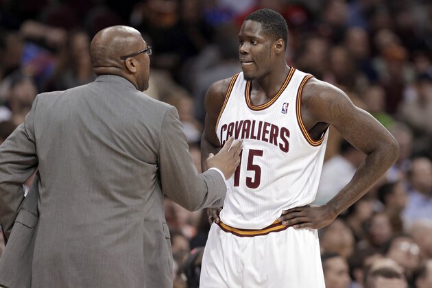 Cleveland Cavaliers coach Mike Brown, left, talks to Anthony Bennett during the third quarter of an NBA basketball game against the San Antonio Spurs on Tuesday, March 4, 2014, in Cleveland. San Antonio won 122-101. (AP Photo/Mark Duncan)