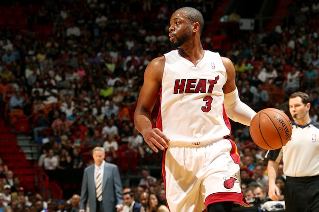 MIAMI, FL - April 16: Dwyane Wade #3 of the Miami Heat drives against the Philadelphia 76ers at the American Airlines Arena in Miami, Florida on April 16, 2014. NOTE TO USER: User expressly acknowledges and agrees that, by downloading and/or using this photograph, user is consenting to the terms and conditions of the Getty Images License Agreement. Mandatory copyright notice: Copyright NBAE 2014 (Photo by Issac Baldizon/NBAE via Getty Images)