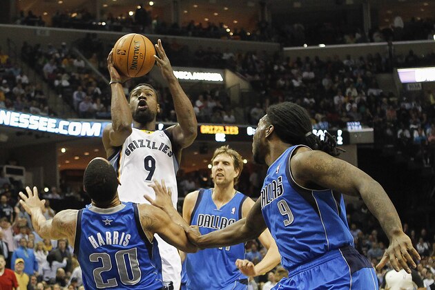 Memphis Grizzlies guard Tony Allen (9) shoots against Dallas Mavericks defenders Devin Harris (20); Dirk Nowitzki, rear, of Germany; and Jae Crowder (9) in the second half of an NBA basketball game Wednesday, April 16, 2014, in Memphis, Tenn. The Grizzlies won in overtime, 106-105. (AP Photo/Lance Murphey)