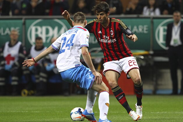 MILAN, ITALY - APRIL 13:  Ricardo Kaka (R) of AC Milan is challenged by Norbert Gyomber (L) of Calcio Catania during the Serie A match between AC Milan and Calcio Catania at San Siro Stadium on April 13, 2014 in Milan, Italy.  (Photo by Marco Luzzani/Getty Images)