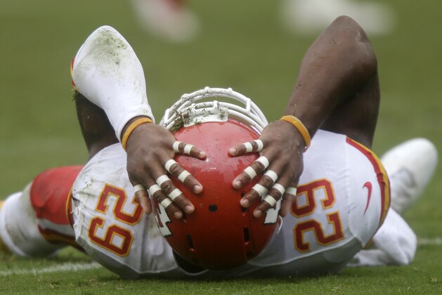 Kansas City Chiefs safety Eric Berry lies on the turf after a play against the Tennessee Titans in the third quarter of an NFL football game on Sunday, Oct. 6, 2013, in Nashville, Tenn. (AP Photo/Wade Payne)