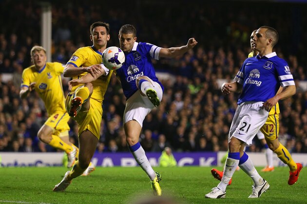 LIVERPOOL, ENGLAND - APRIL 16:  Jose Campana of Crystal Palace and Kevin Mirallas of Everton compete for the ball during the Barclays Premier League match between Everton and Crystal Palace at Goodison Park on April 16, 2014 in Liverpool, England.  (Photo by Clive Brunskill/Getty Images)