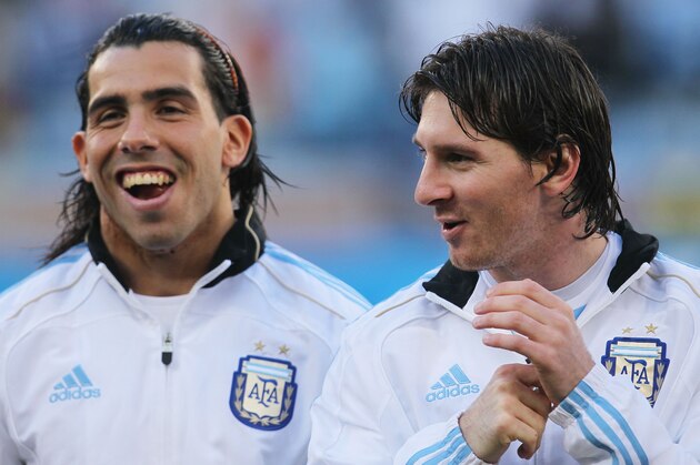 CAPE TOWN, SOUTH AFRICA - JULY 03:  Carlos Tevez and Lionel Messi of Argentina share a joke ahead of the 2010 FIFA World Cup South Africa Quarter Final match between Argentina and Germany at Green Point Stadium on July 3, 2010 in Cape Town, South Africa.  (Photo by Chris McGrath/Getty Images)