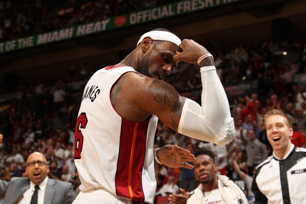 MIAMI, FL - April 11:   LeBron James #6 of the Miami Heat flexes during the game against the Indiana Pacers at the American Airlines Arena in Miami, Florida on April 11, 2014. NOTE TO USER: User expressly acknowledges and agrees that, by downloading and/or using this photograph, user is consenting to the terms and conditions of the Getty Images License Agreement. Mandatory copyright notice: Copyright NBAE 2014 (Photo by Issac Baldizon/NBAE via Getty Images)