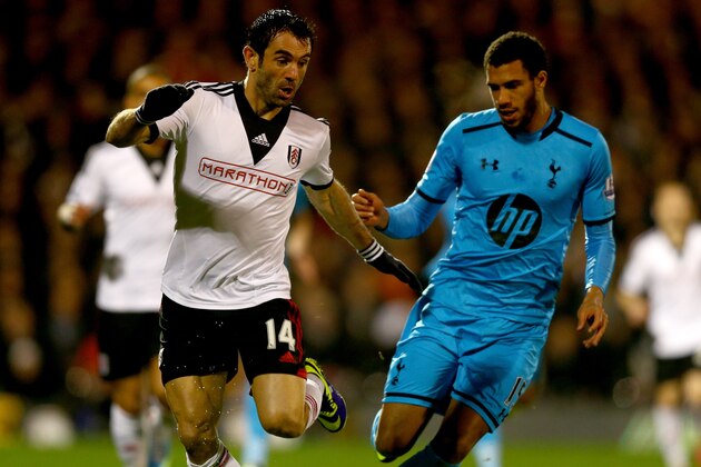 LONDON, ENGLAND - DECEMBER 04:  Giorgos Karagounis of Fulham takes on Etienne Capoue of Tottenham Hotspur during the Barclays Premier League match between Fulham and Tottenham Hotspur at Craven Cottage on December 4, 2013 in London, England.  (Photo by Paul Gilham/Getty Images)
