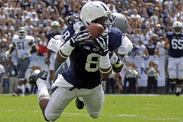 FILE- In this Sept. 7, 2013, file photo, Penn State wide receiver Allen Robinson (8) hauls in a 43-yard pass from quarterback Christian Hackenberg asith Eastern Michigan defensive back Willie Creear makes the tackle during the first quarter of an NCAA college football game in State College, Pa. With each new game, Robinson is seemingly landing in the program record books, and will be a key cog to a Penn State resurgence this season, if there is one. The Nittany Lions have lost two of three games, and will play host to No. 18 Michigan on Saturday. (AP Photo/Gene J. Puskar, File)