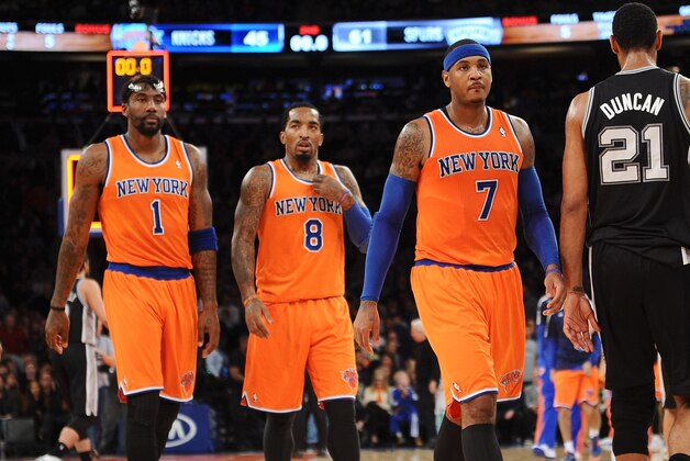 NEW YORK, NY - NOVEMBER 10:  Carmelo Anthony #7 of the New York Knicks and his teammates J.R. Smith #8 and Amar'e Stoudemire #1 walk into the locker room at half time against the San Antonio Spurs at Madison Square Garden on November 10, 2013 in New York City. The Spurs defeat the Knicks 120-89. NOTE TO USER: User expressly acknowledges and agrees that, by downloading and/or using this photograph, user is consenting to the terms and conditions of the Getty Images License Agreement.  (Photo by Maddie Meyer/Getty Images)
