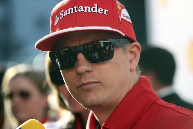 Ferrari driver Kimi Raikkonen of Finland  listens to questions from the media during a publicity event at the Formula One Australian Grand Prix at Albert Park in Melbourne, Australia, Wednesday, March 12, 2014. (AP Photo/Rob Griffith)