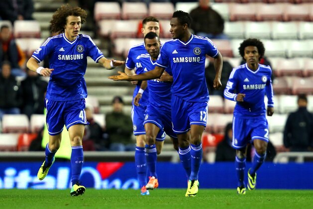 SUNDERLAND, ENGLAND - DECEMBER 17:  David Luiz and John Obi Mikel of Chelsea high five after the opening goal during the Capital One Cup Quarter-Final match between Sunderland and Chelsea  at Stadium of Light on December 17, 2013 in Sunderland, England.  (Photo by Jan Kruger/Getty Images)