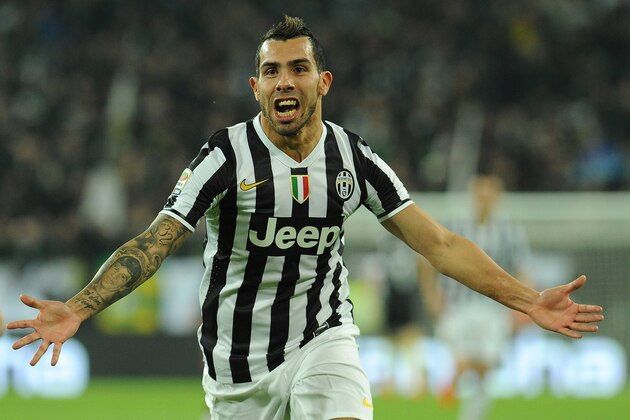 TURIN, ITALY - FEBRUARY 23:  Carlos Tevez of Juventus celebrates after scoring the opening goal during the Serie A match between Juventus and Torino FC at Juventus Arena on February 23, 2014 in Turin, Italy.  (Photo by Valerio Pennicino/Getty Images)