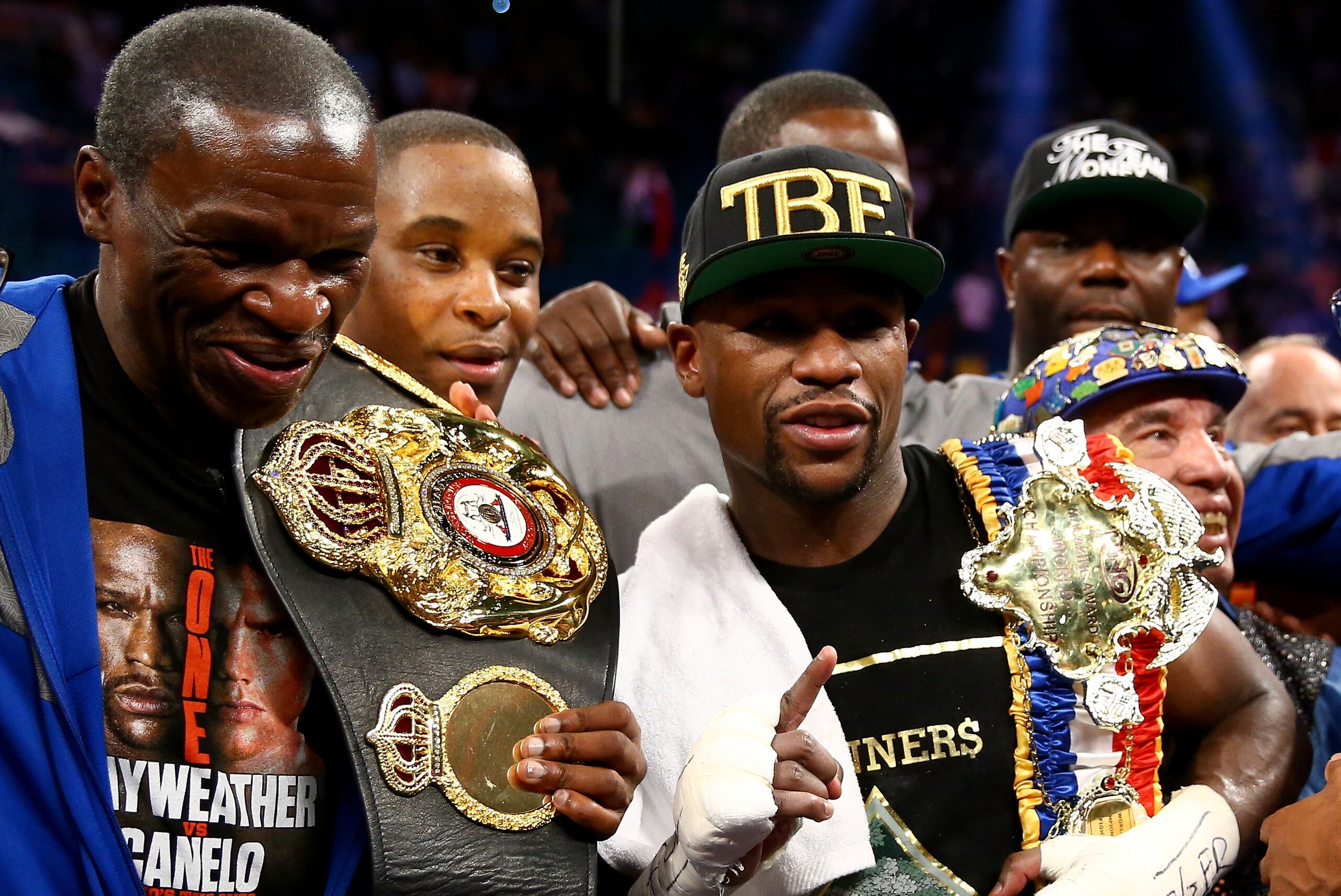 LAS VEGAS, NV - SEPTEMBER 14: Trainer/father Floyd Mayweather Sr. and Floyd Mayweather Jr. celebrate the majority decision victory against Canelo Alvarez in their WBC/WBA 154-pound title fight at the MGM Grand Garden Arena on September 14, 2013 in Las Vegas, Nevada. (Photo by Al Bello/Getty Images) LAS VEGAS, NV - SEPTEMBER 14: Trainer/father Floyd Mayweather Sr. and Floyd Mayweather Jr. celebrate the majority decision victory against Canelo Alvarez in their WBC/WBA 154-pound title fight at the MGM Grand Garden Arena on September 14, 2013 in Las Vegas, Nevada. (Photo by Al Bello/Getty Images)