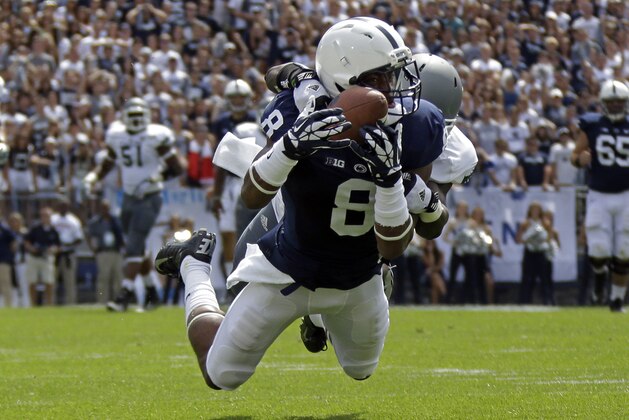 Penn State wide receiver Allen Robinson (8) hauls in a 43-yard pass from Penn State quarterback Christian Hackenberg with Eastern Michigan defensive back Willie Creear making the tackle during the first quarter of an NCAA college football game in State College, Pa., Saturday, Sept. 7, 2013. (AP Photo/Gene J. Puskar)