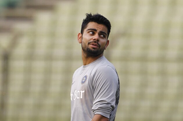 India's Virat Kohli stands next to the nets as he waits to bat during a training session ahead of their ICC Twenty20 Cricket World Cup semifinal match against South Africa in Dhaka, Bangladesh, Wednesday, April 2, 2014. (AP Photo/A.M. Ahad)