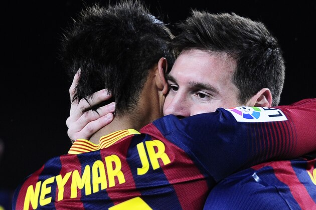 FC Barcelona's Lionel Messi, from Argentina, right, reacts after scoring with his teammate Neymar, from Brazil, during a Spanish La Liga soccer match against Celta Vigo at the Camp Nou stadium in Barcelona, Spain, Wednesday, March 26, 2014. (AP Photo/Manu Fernandez)