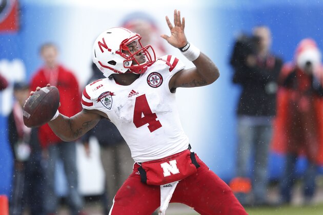 JACKSONVILLE, FL - JANUARY 1: Tommy Armstrong Jr. #4 of the Nebraska Cornhuskers lets loose on a 99-yard touchdown pass to Quincy Enunwa in the third quarter against the Georgia Bulldogs during the TaxSlayer.com Gator Bowl at Everbank Field on January 1, 2014 in Jacksonville, Florida. Nebraska won the game 24-19. (Photo by Joe Robbins/Getty Images)