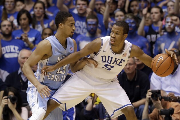 Duke's Rodney Hood (5) is pressured by North Carolina's J.P. Tokoto (13) during the first half of an NCAA college basketball game in Durham, N.C., Saturday, March 8, 2014. (AP Photo/Gerry Broome) Duke's Rodney Hood (5) is pressured by North Carolina's J.P. Tokoto (13) during the first half of an NCAA college basketball game in Durham, N.C., Saturday, March 8, 2014. (AP Photo/Gerry Broome)
