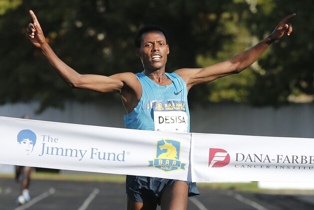 Reigning Boston Marathon champion Lelisa Desisa, of Ethiopia, wins the Boston Half marathon in Boston, Sunday, Oct. 13, 2013. (AP Photo/Michael Dwyer) Reigning Boston Marathon champion Lelisa Desisa, of Ethiopia, wins the Boston Half marathon in Boston, Sunday, Oct. 13, 2013. (AP Photo/Michael Dwyer)