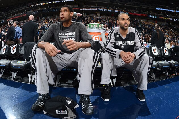 DENVER, CO - MARCH 28: Tim Duncan #21 and Tony Parker #9 of the San Antonio Spurs before a game against the Denver Nuggets on March 28, 2014 at the Pepsi Center in Denver, Colorado. NOTE TO USER: User expressly acknowledges and agrees that, by downloading and/or using this Photograph, user is consenting to the terms and conditions of the Getty Images License Agreement. Mandatory Copyright Notice: Copyright 2014 NBAE (Photo by Garrett W. Ellwood/NBAE via Getty Images)