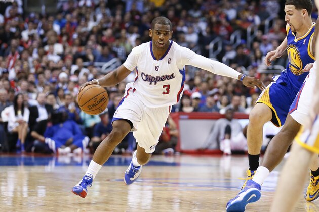 Los Angeles Clippers' Chris Paul drives around Golden State Warriors' Klay Thompson during the second half of an NBA basketball game in Los Angeles, Wednesday, March 12, 2014. The Clippers won 111-98. (AP Photo/Danny Moloshok)