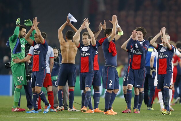 PSG's players celebrate their victory against Bayer Leverkusen during the Champions League last 16 second leg soccer match at Parc des Princes stadium in Paris, Wednesday, March 12, 2014. PSG won the match 2-1. (AP Photo/Michel Euler)