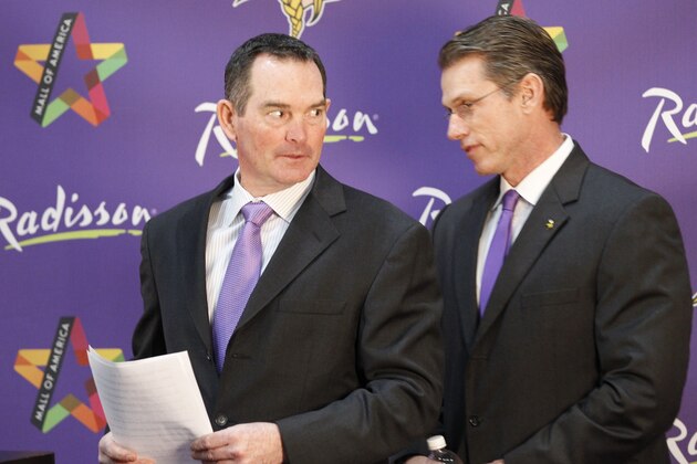 New Minnesota Vikings head coach Mike Zimmer, left, talks with general manager Rick Spielman, right, at Winter Park in Eden Prairie, Minn., Friday, Jan. 17, 2014. Zimmer is the ninth head coach in the Vikings franchise history.(AP Photo/Ann Heisenfelt)