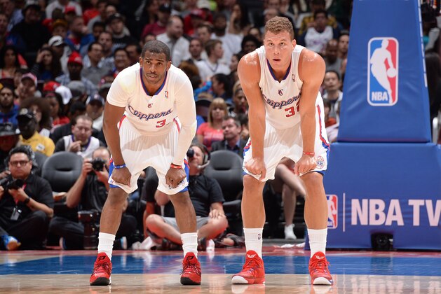 LOS ANGELES, CA - APRIL 15: Chris Paul #3 and Blake Griffin #32 of the Los Angeles Clippers look on against the Denver Nuggets at Staples Center on April 15, 2014 in Los Angeles, California. NOTE TO USER: User expressly acknowledges and agrees that, by downloading and/or using this Photograph, user is consenting to the terms and conditions of the Getty Images License Agreement. Mandatory Copyright Notice: Copyright 2014 NBAE (Photo by Andrew D. Bernstein/NBAE via Getty Images)