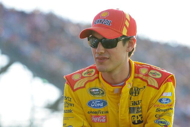 Joey Logano celebrates winning the NASCAR Sprint Cup Series auto race at Texas Motor Speedway Monday, April 7, 2014, in Fort Worth, Texas. (AP Photo/Mike Stone)