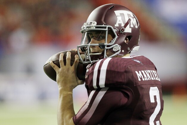 Texas A&M quarterback Johnny Manziel (2) warms up before the start of the Chick-fil-A Bowl NCAA college football game against Duke Tuesday, Dec. 31, 2013, in Atlanta. (AP Photo/John Bazemore)