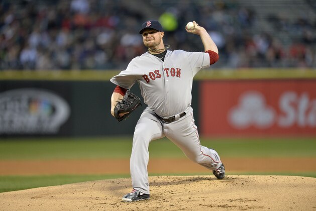 CHICAGO, IL - APRIL 17:  Starting pitcher Jon Lester #31 of the Boston Red Sox delivers during the first inning against the Chicago White Sox at U.S. Cellular Field on April 17, 2014 in Chicago, Illinois.  (Photo by Brian Kersey/Getty Images)