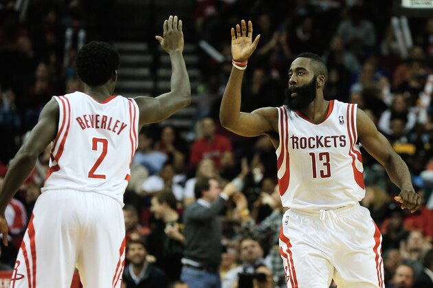 HOUSTON, TX - DECEMBER 06:  James Harden #13 and Patrick Beverley #2 of the Houston Rockets react to a three-point shot late in the fourth quarter during the game against the Golden State Warriors at Toyota Center on December 6, 2013 in Houston, Texas. NOTE TO USER: User expressly acknowledges and agrees that, by downloading and or using this photograph, User is consenting to the terms and conditions of the Getty Images License Agreement.  (Photo by Scott Halleran/Getty Images)