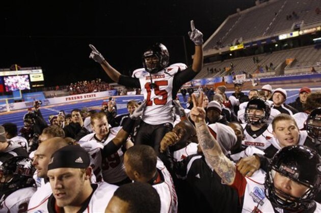 Northern Illinois' Jimmie Ward (15) celebrates with his teammates after defeating Fresno State in the Humanitarian Bowl NCAA college football game, Saturday, Dec. 18, 2010, in Boise, Idaho. Northern Illinois won 40-17.  (AP Photo/Matt Cilley)